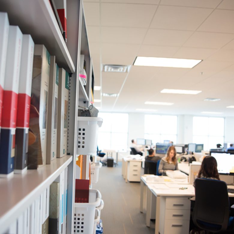 Interior of office room and white bookshelves