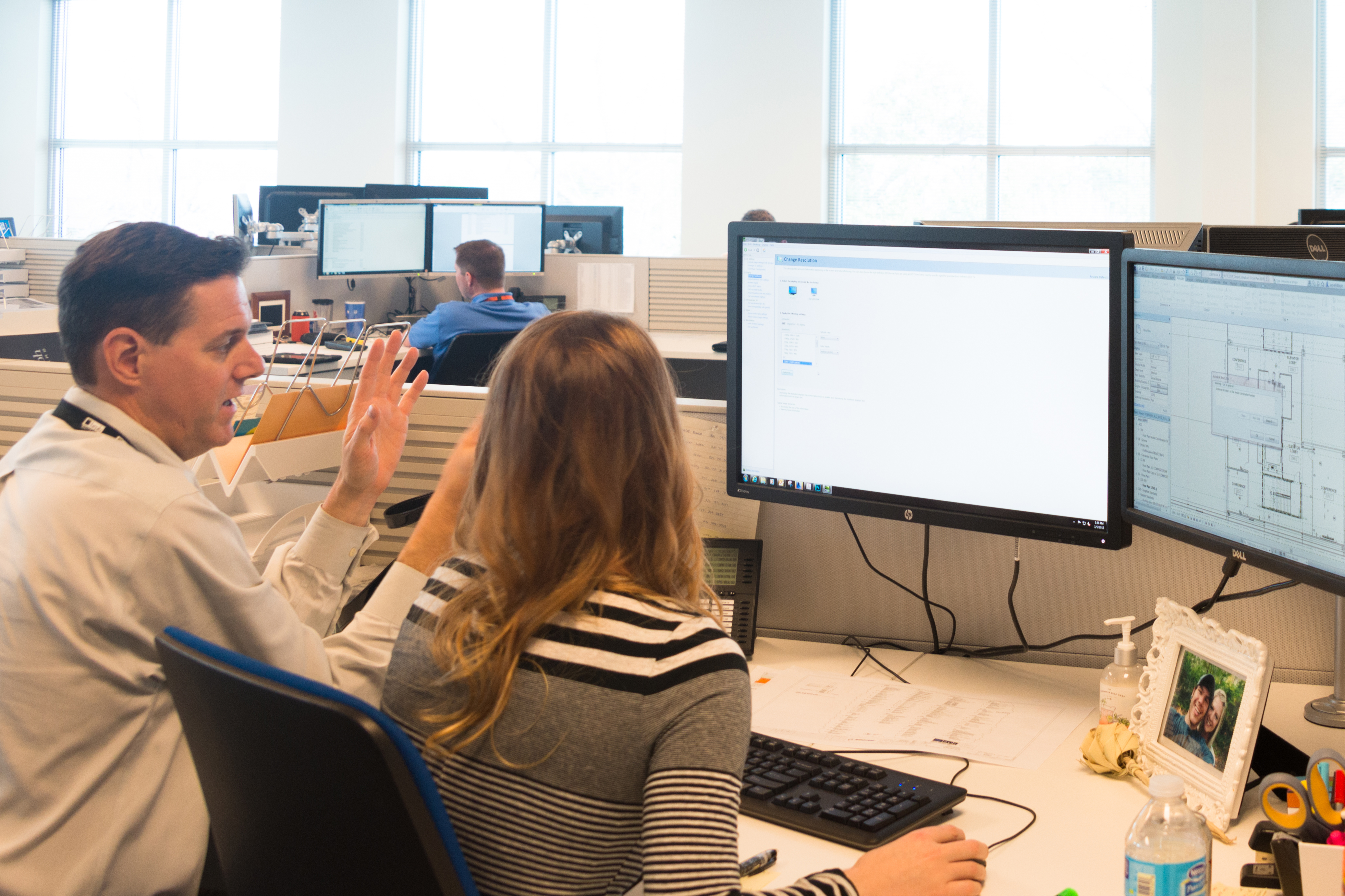 Two team members at a desk Two team members at a desk