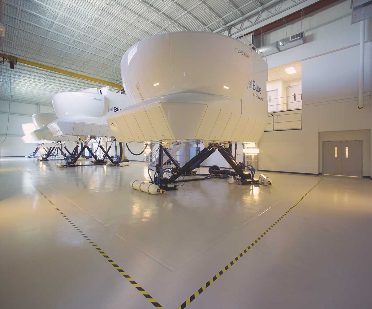 White hangar with white plane attachments