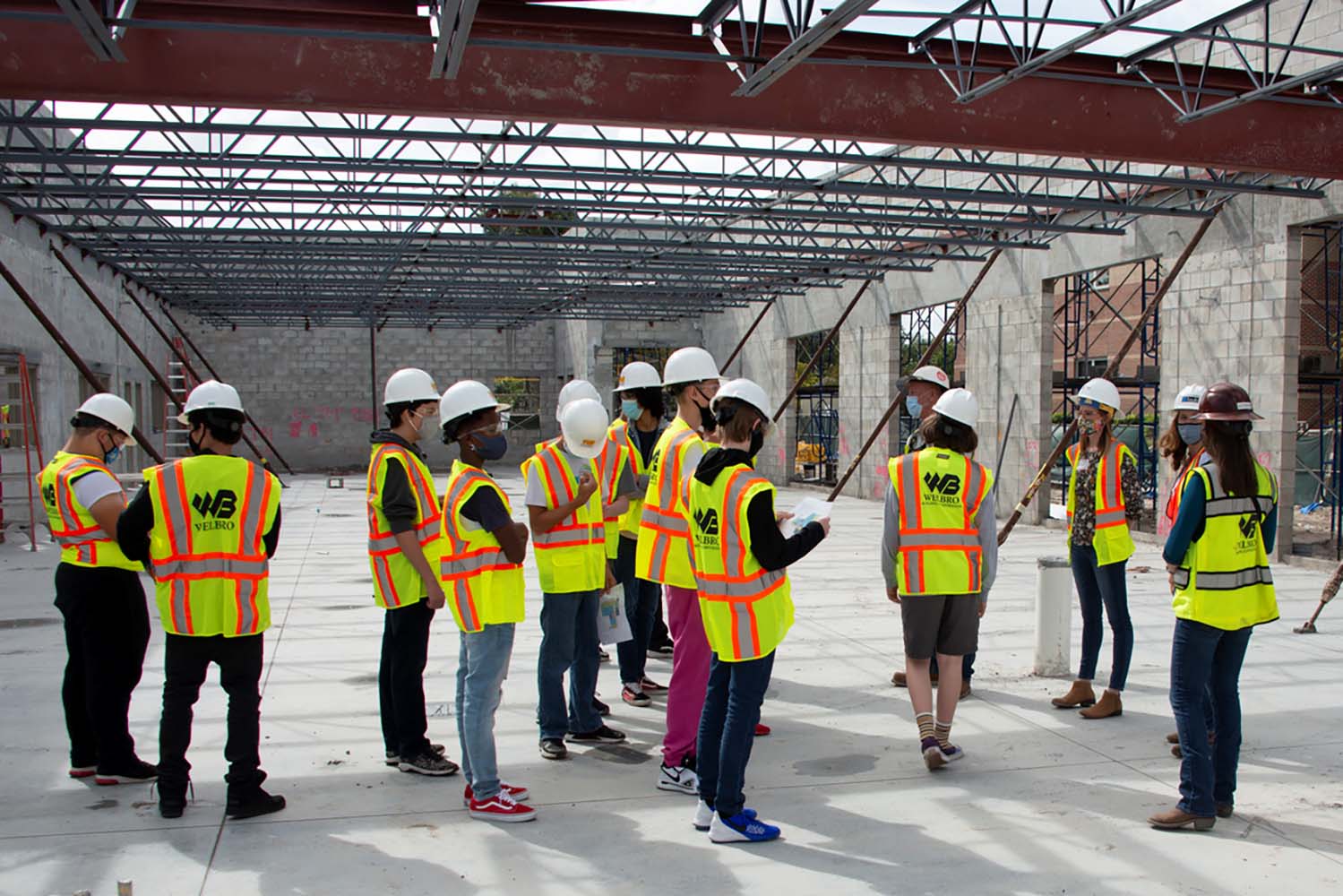 Melbourne employees giving a tour of building during construction