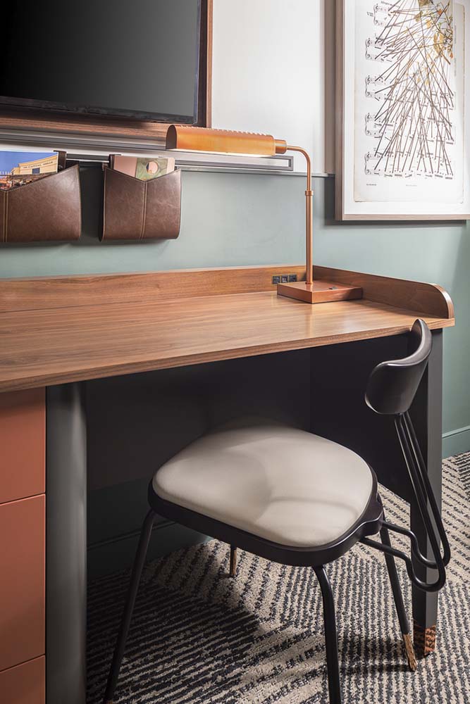 Brown desk with gray chair