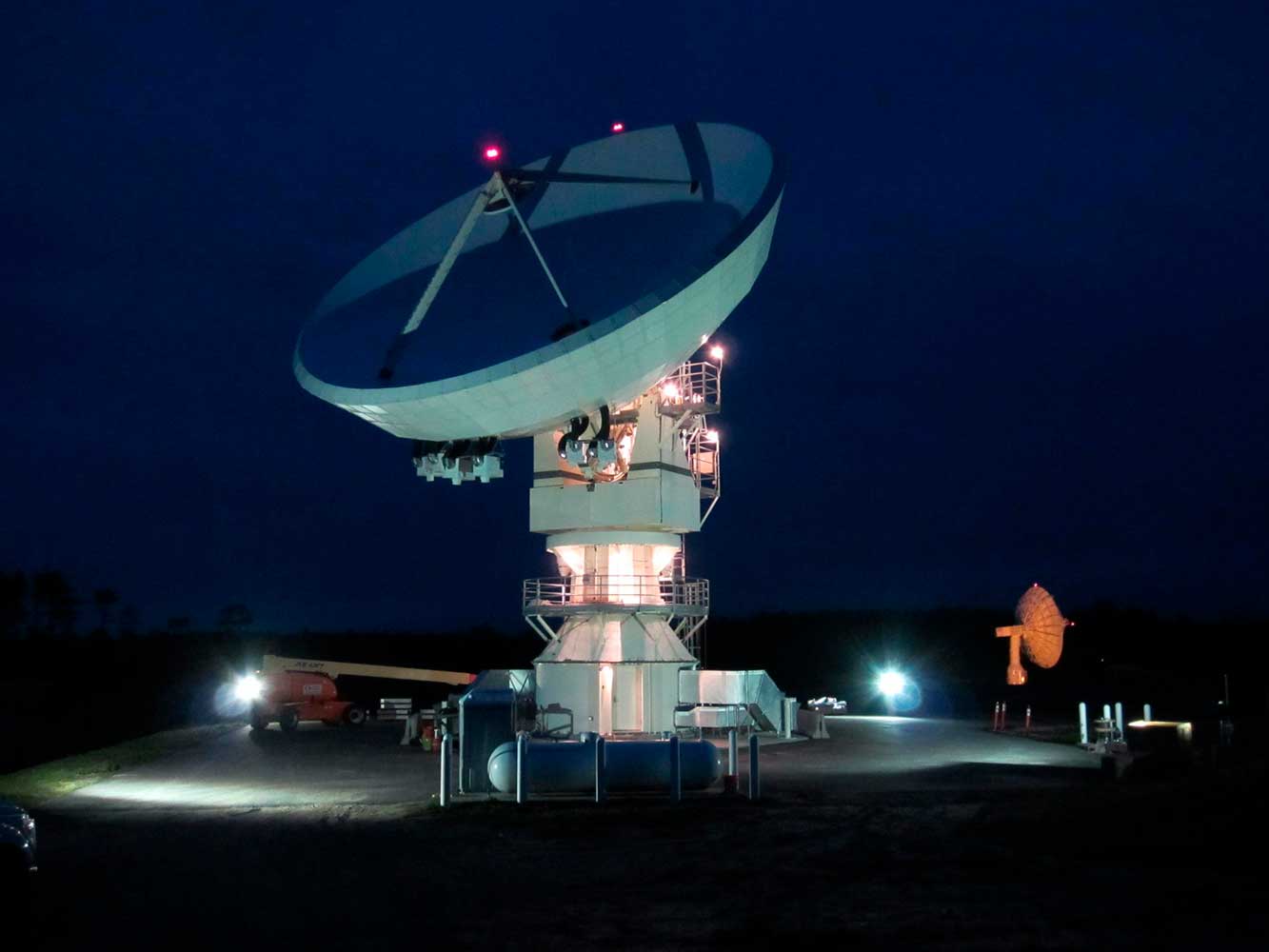 Large space satellite dish at night
