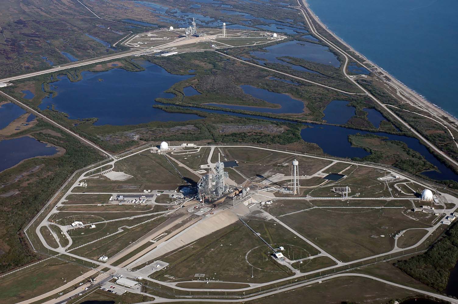 Aerial photo of Space shuttle launch complexes 39A and B at Kennedy Space Center.
