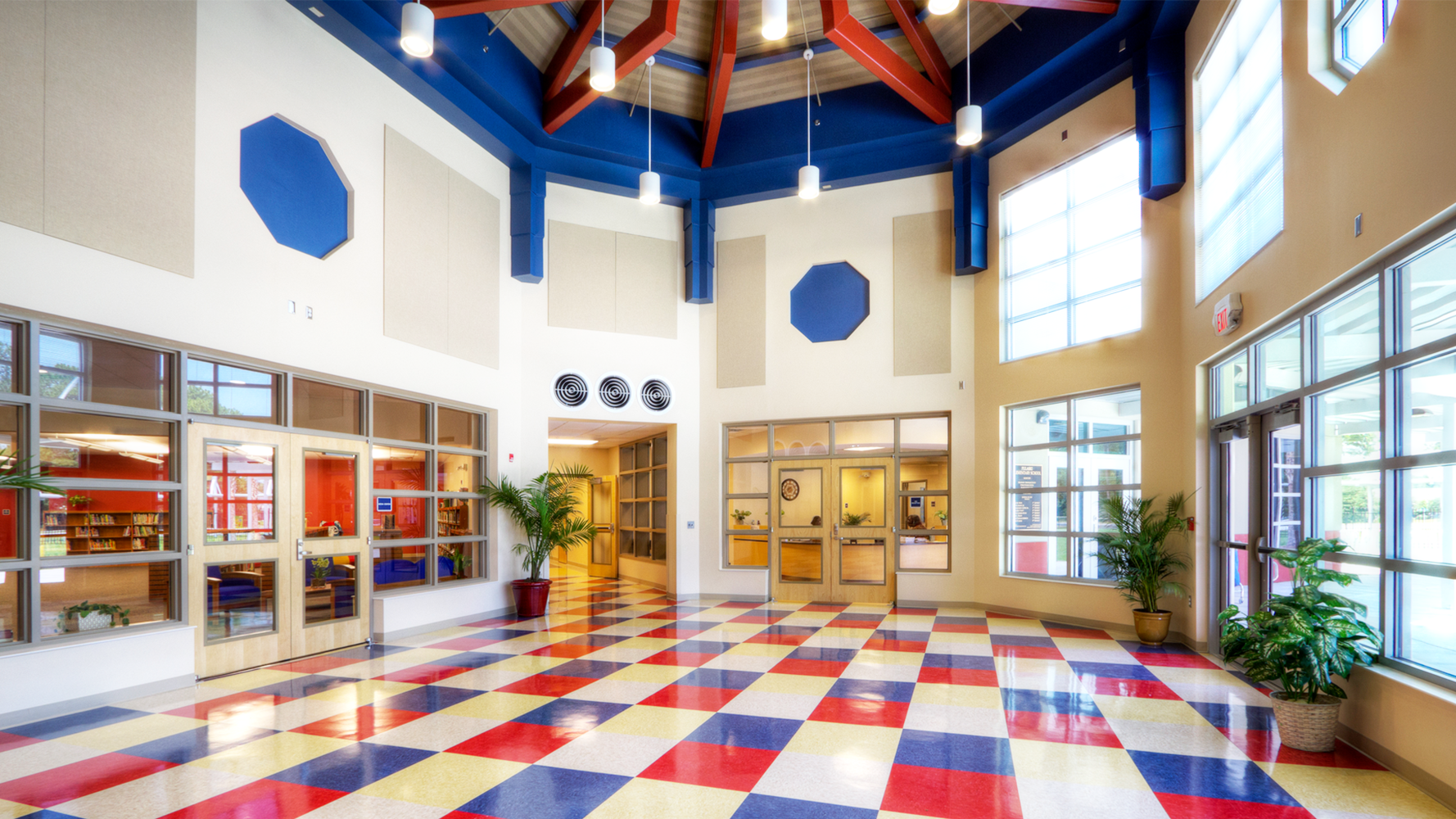 School entrance with red/blue/white checkered floor and white/blue walls