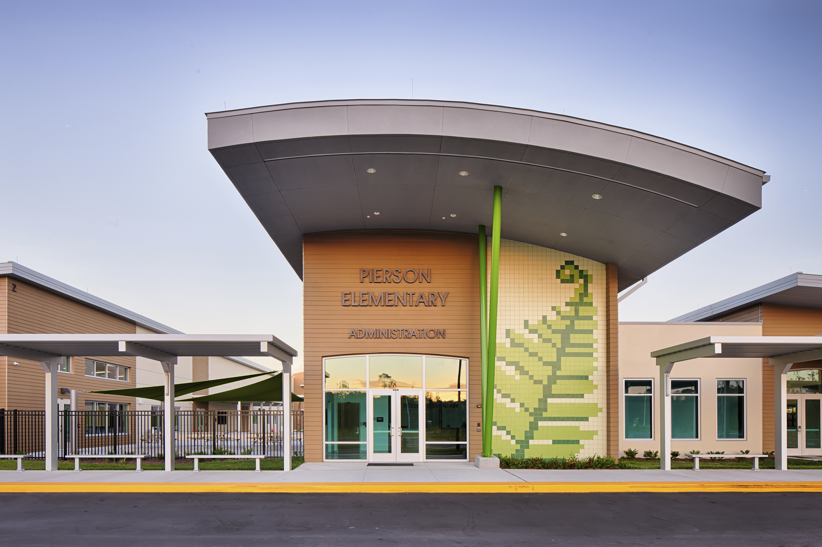 outdoor shot of elementary school with leaf design in tile