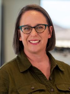 woman in glasses in green dress