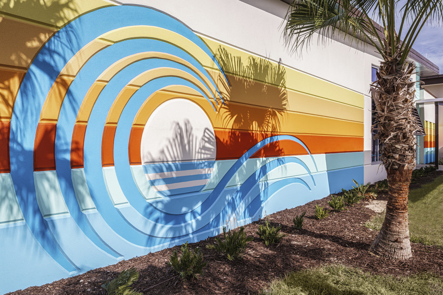 Side of building with colorful ocean wave