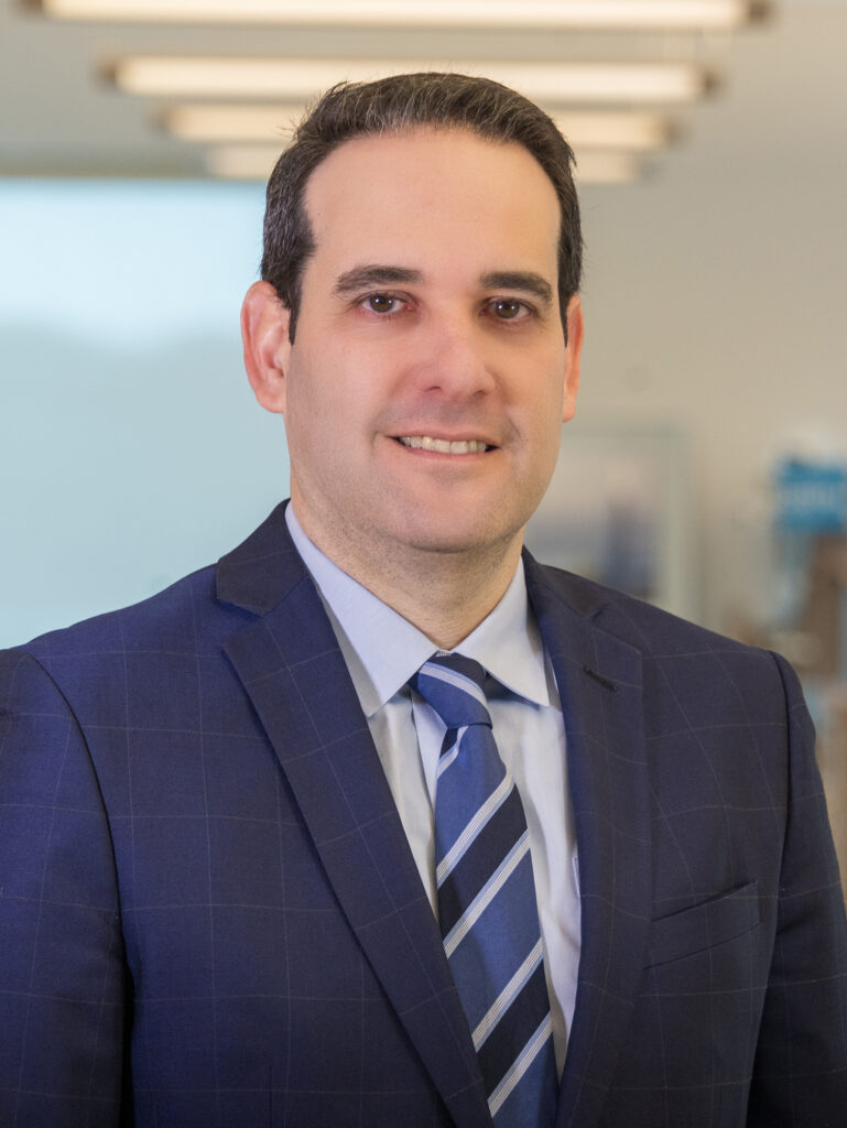 Man in suit and tie looking at camera