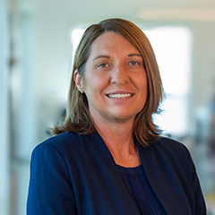 woman with medium length brown hair smiling